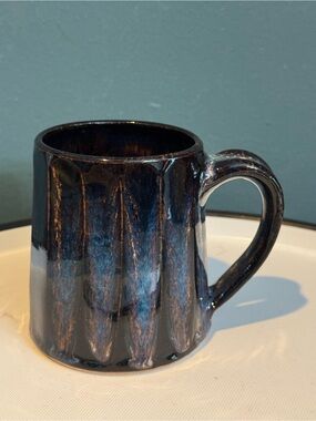 Studio pottery mug with fluted design and blue and black glaze - hand crafted